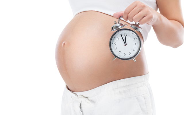 pregnant woman with clock