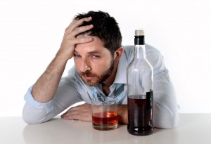 drunk businessman wasted drinking alcohol suffering hangover